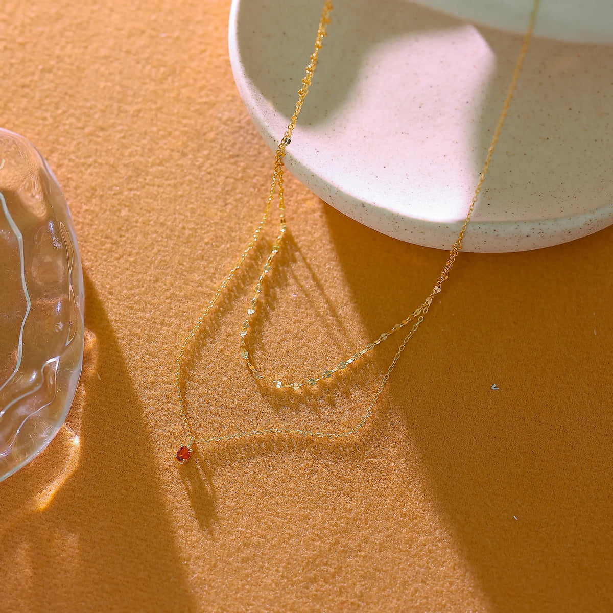 Delicate gold cable chain texture with lobster clasp and adjustable extender.