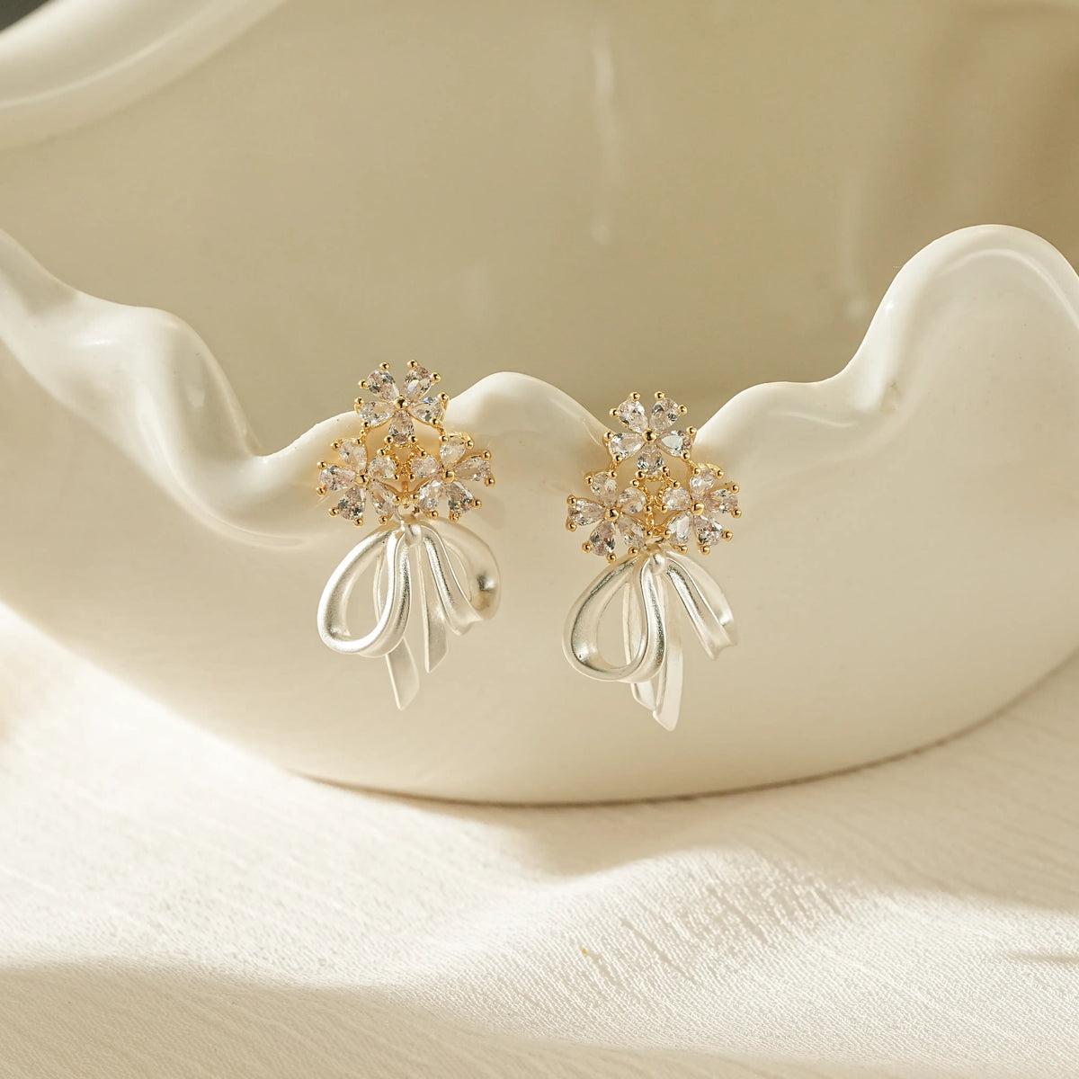 Floral CZ Bow Drop Earrings – Clip-On or Stud