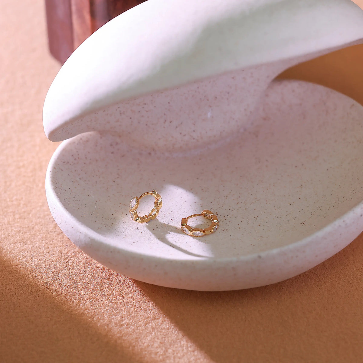 Detail of the secure latch closure and 925 hallmark on the hoop earring post.