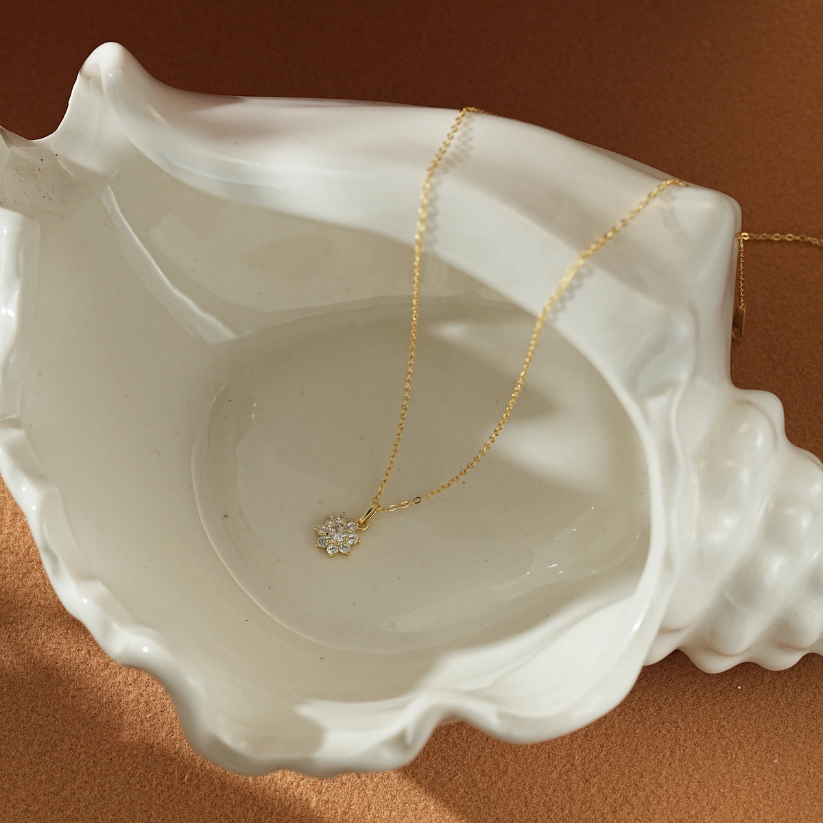 The Snowflake Necklace presented inside a luxury Dialuxé jewelry display box.